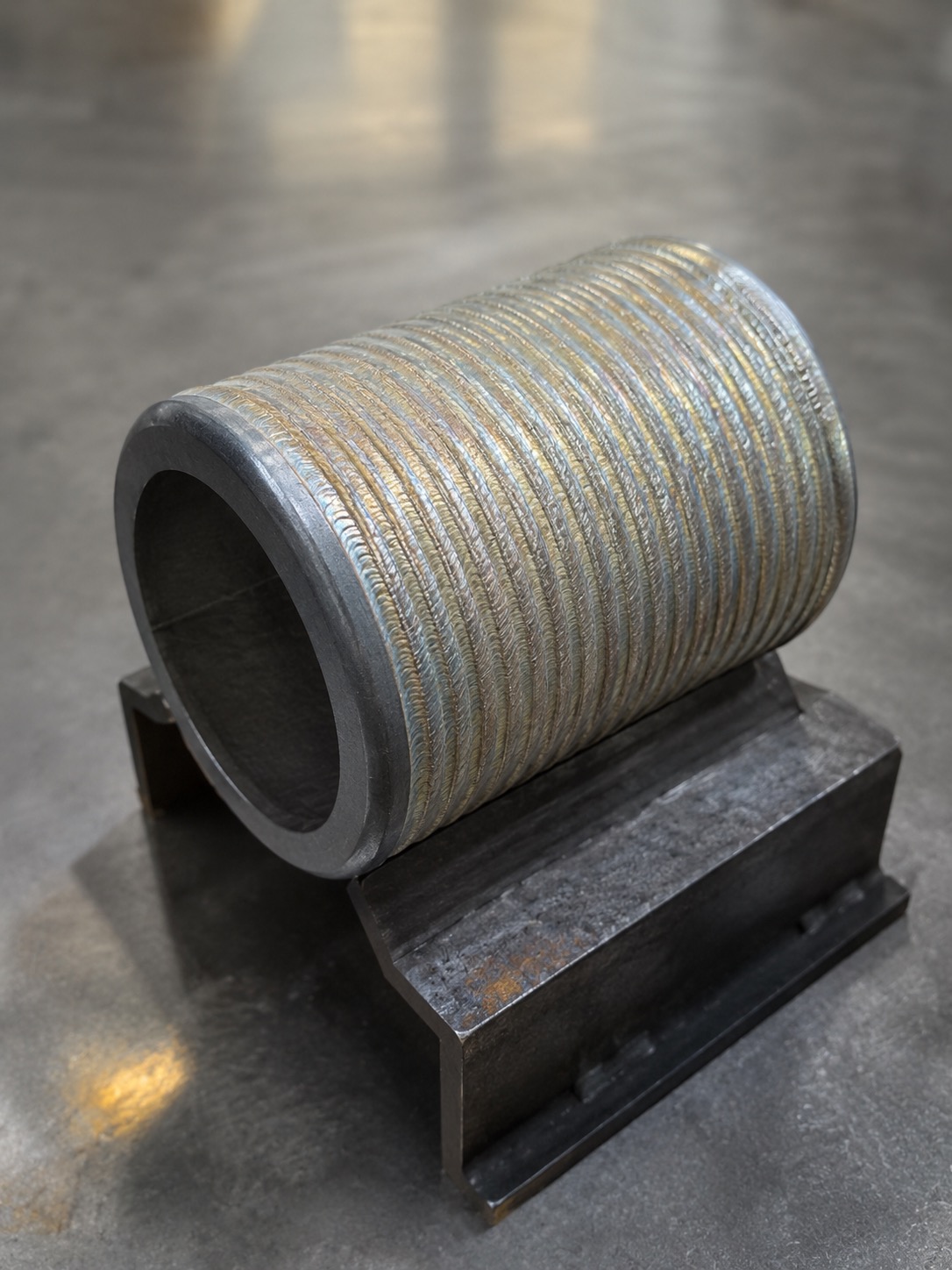 Hardfaced sleeve overlay example with machining allowance confirmed by drawing